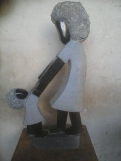 Joy (Carved Stone Mother and Toddler sculpture)