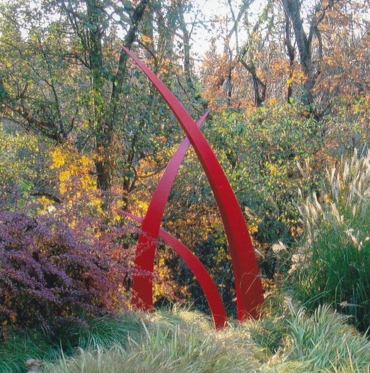 West Winds (Tall Red Abstract Repetitive Steel statue)
