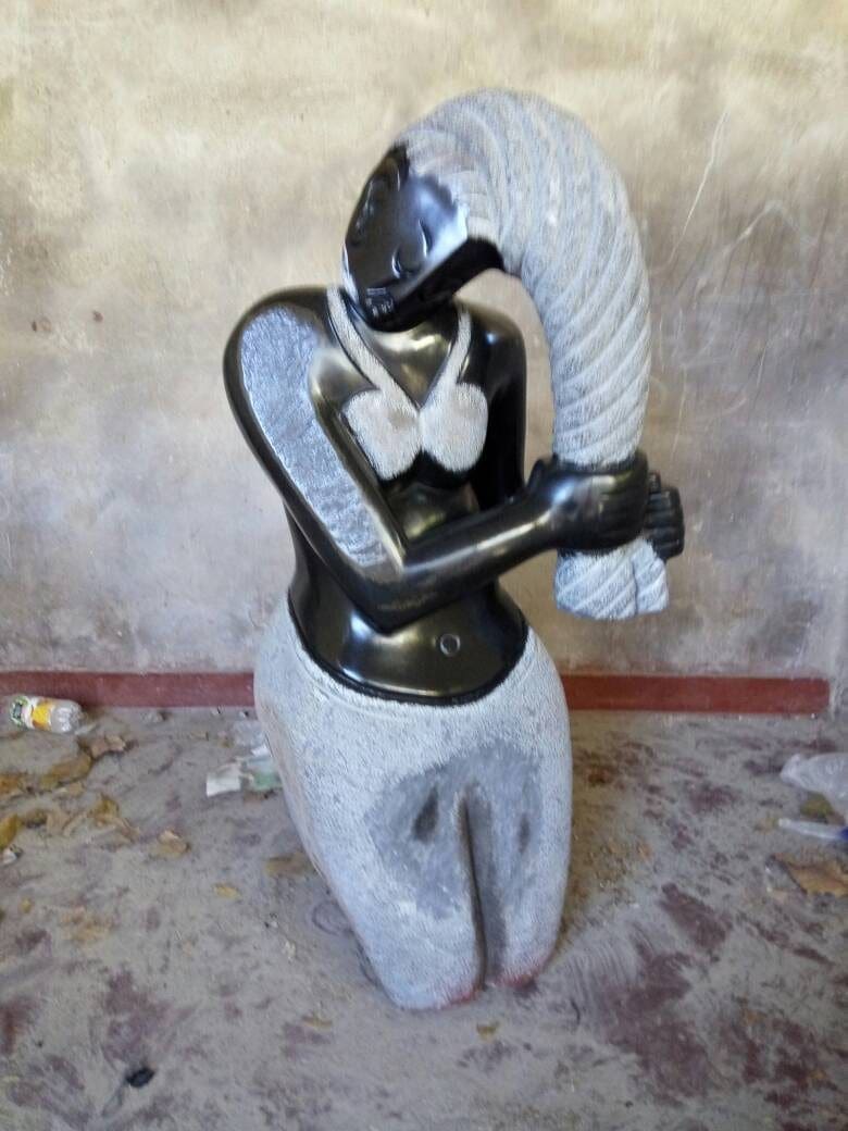 Doing my Hair (Springstone Abstract African Woman statue)