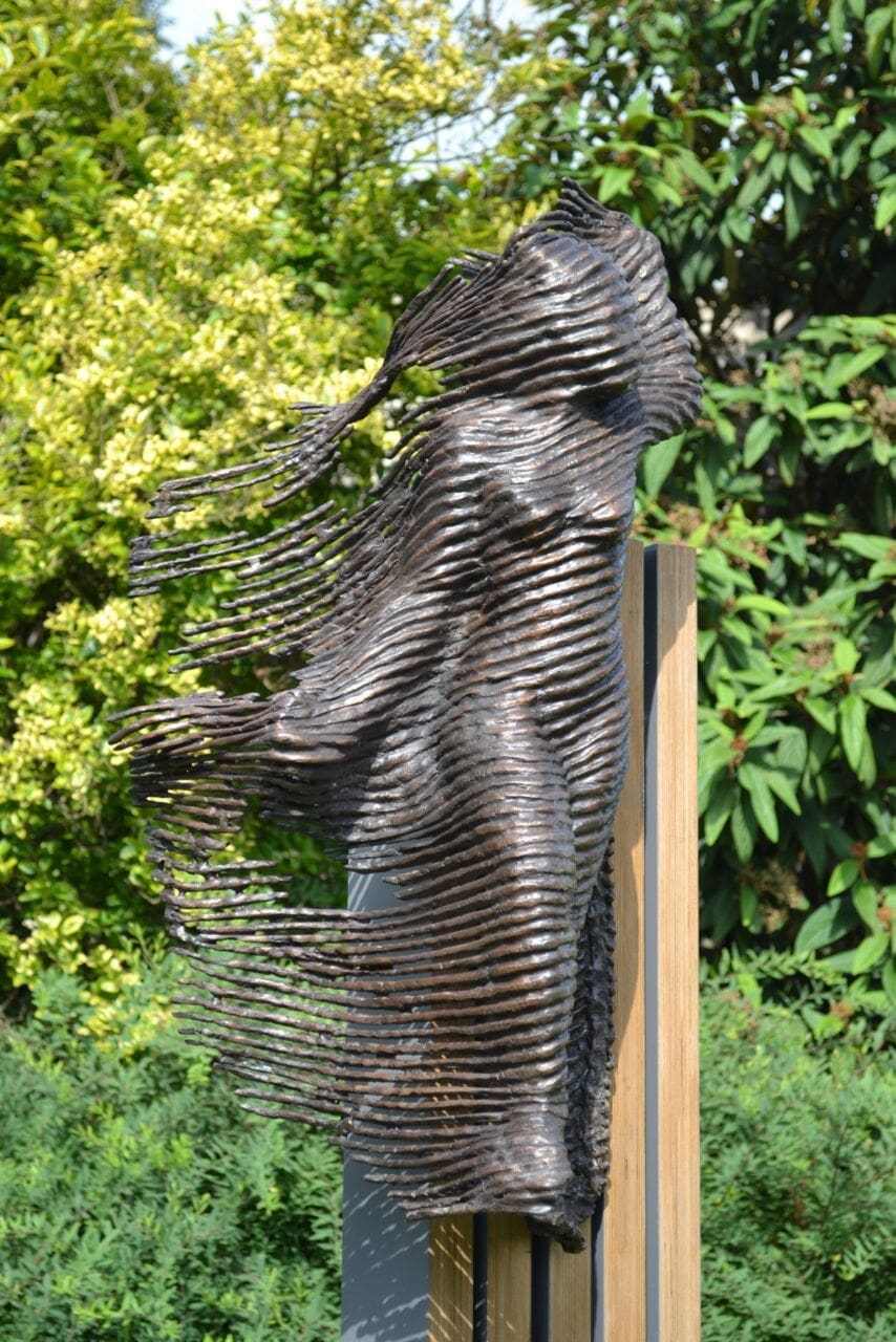 The Phantom (Bronze Abstract Female Worn Ragged Clothing Garden statue)