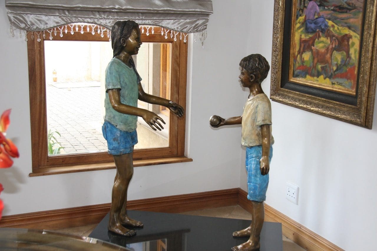Kirsten and Xander (Boy and Girl Playing Ball sculptures)