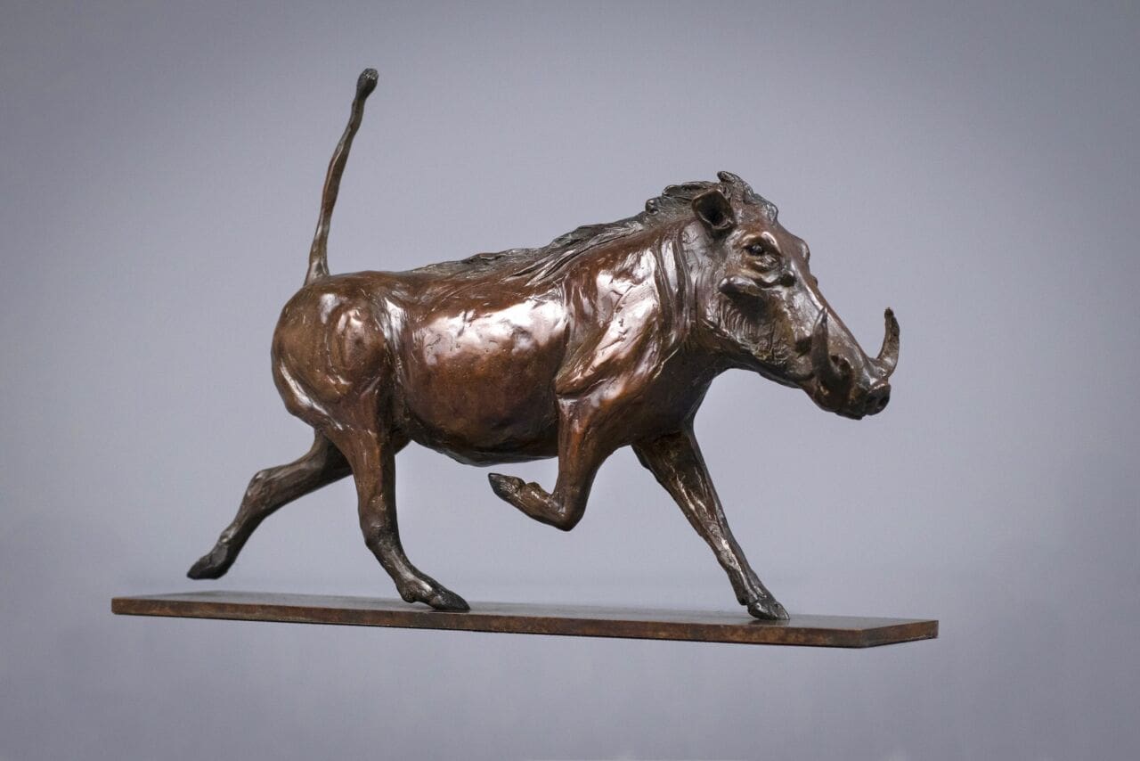 Trotting Warthog (Little Bronze Table Top sculpture)