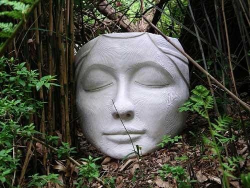 The Ponderer (Calm Carved Woman`s Face Mask sculpture)