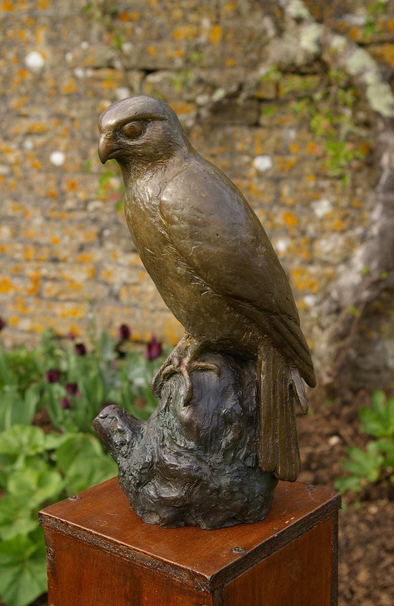 Merlin (Bronze Falcon Perched on Stump sculpture)