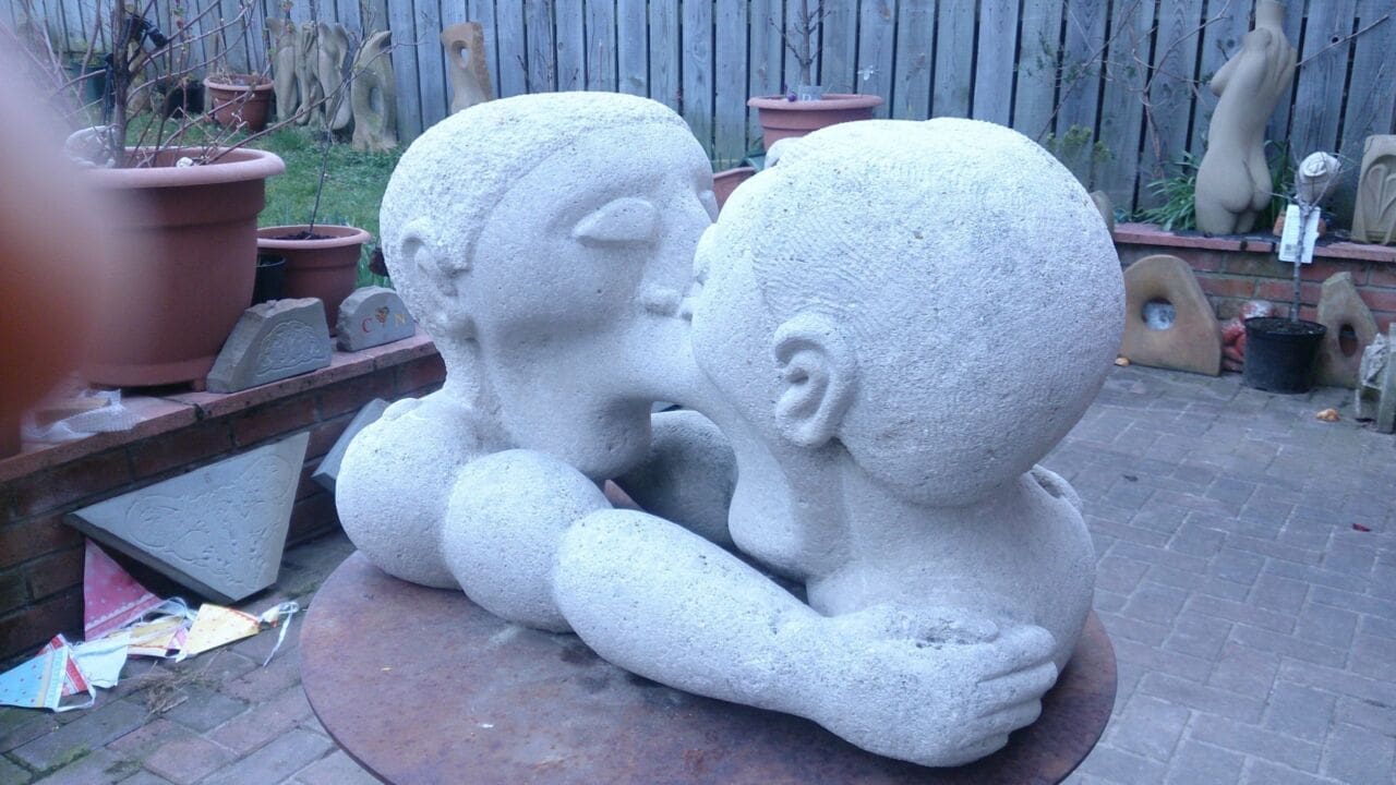 Kissing Cousins (Symbolic Men Kissing Stone statue) - Image 2