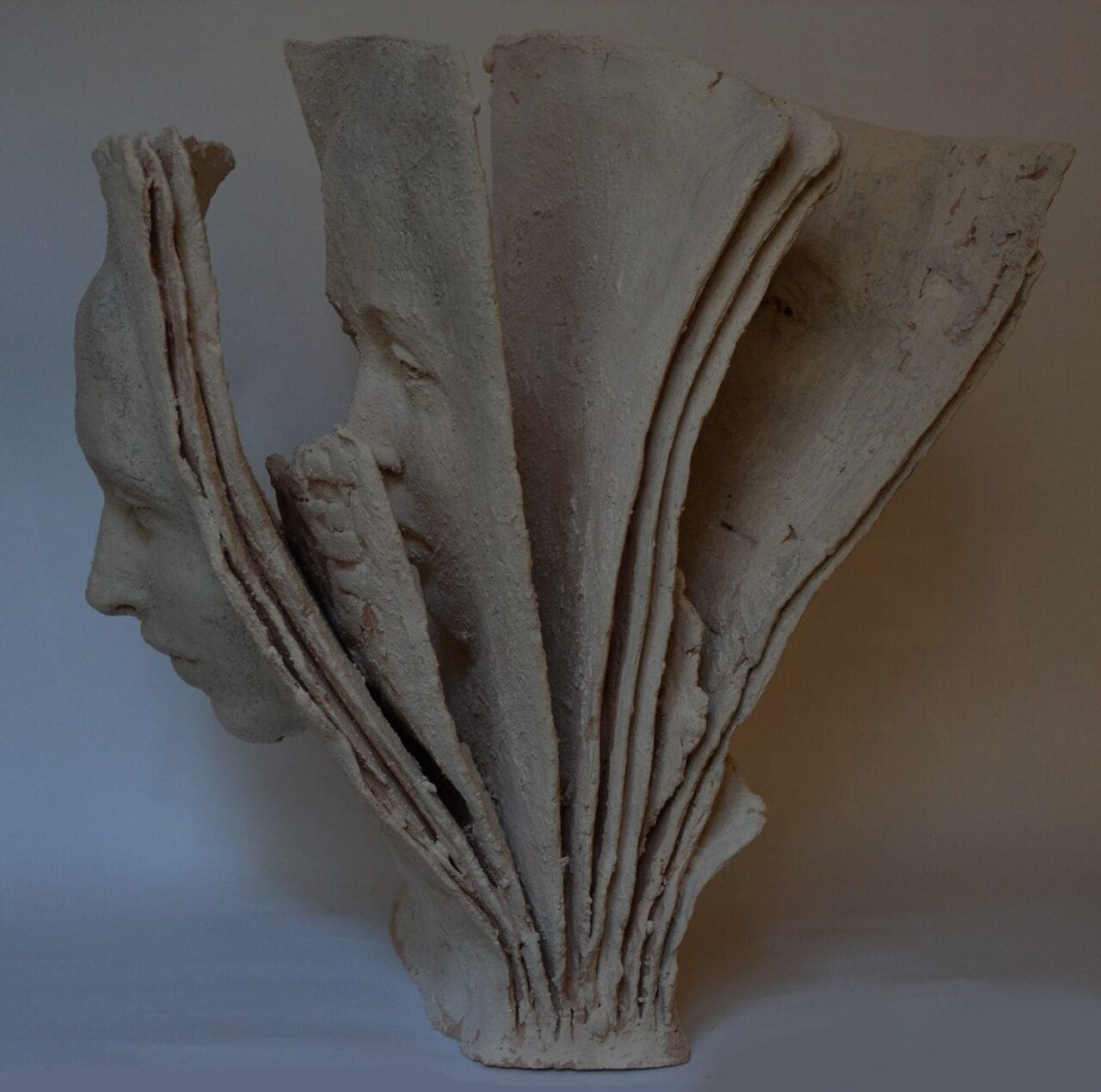 Between Pages (Abstract Girl Faces Terracotta statue)
