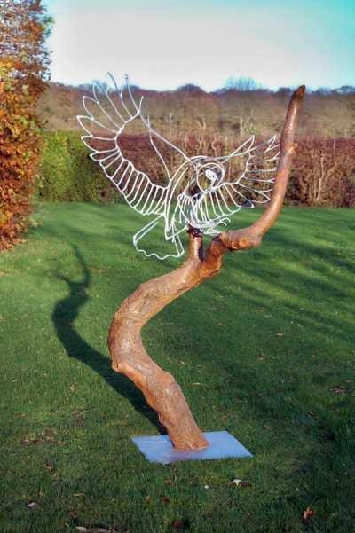 Owl sculpture in driftwood and welded steel by Amy Goodman