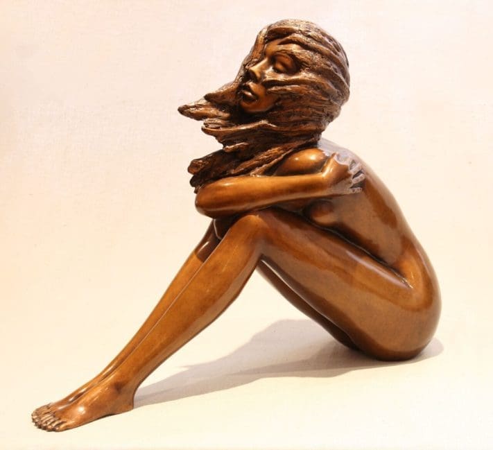 Evanescence bronze sculpture by Angela Farquharson – elegant seated nude female statue for garden or interior display.