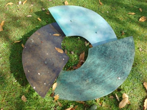Mild steel abstract garden sculpture “Convergence” by Antonia Spowers.