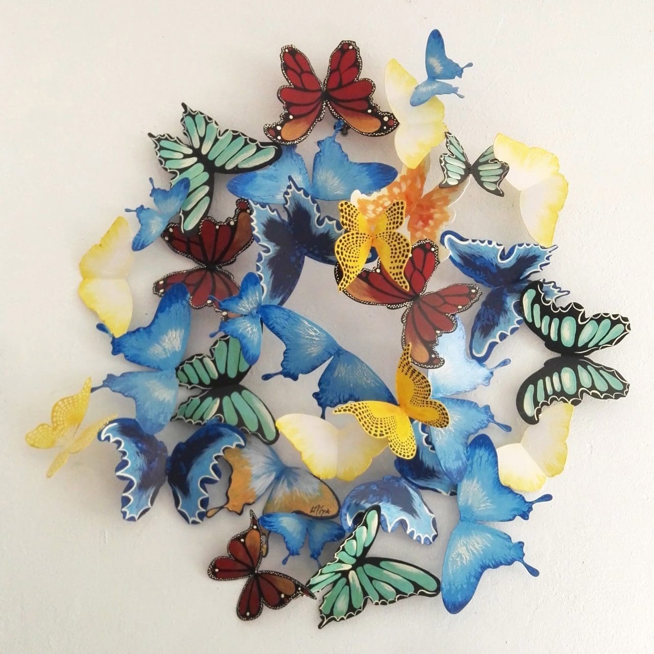 Butterfly Dance painted iron garden sculpture by Liliya Pobornikova