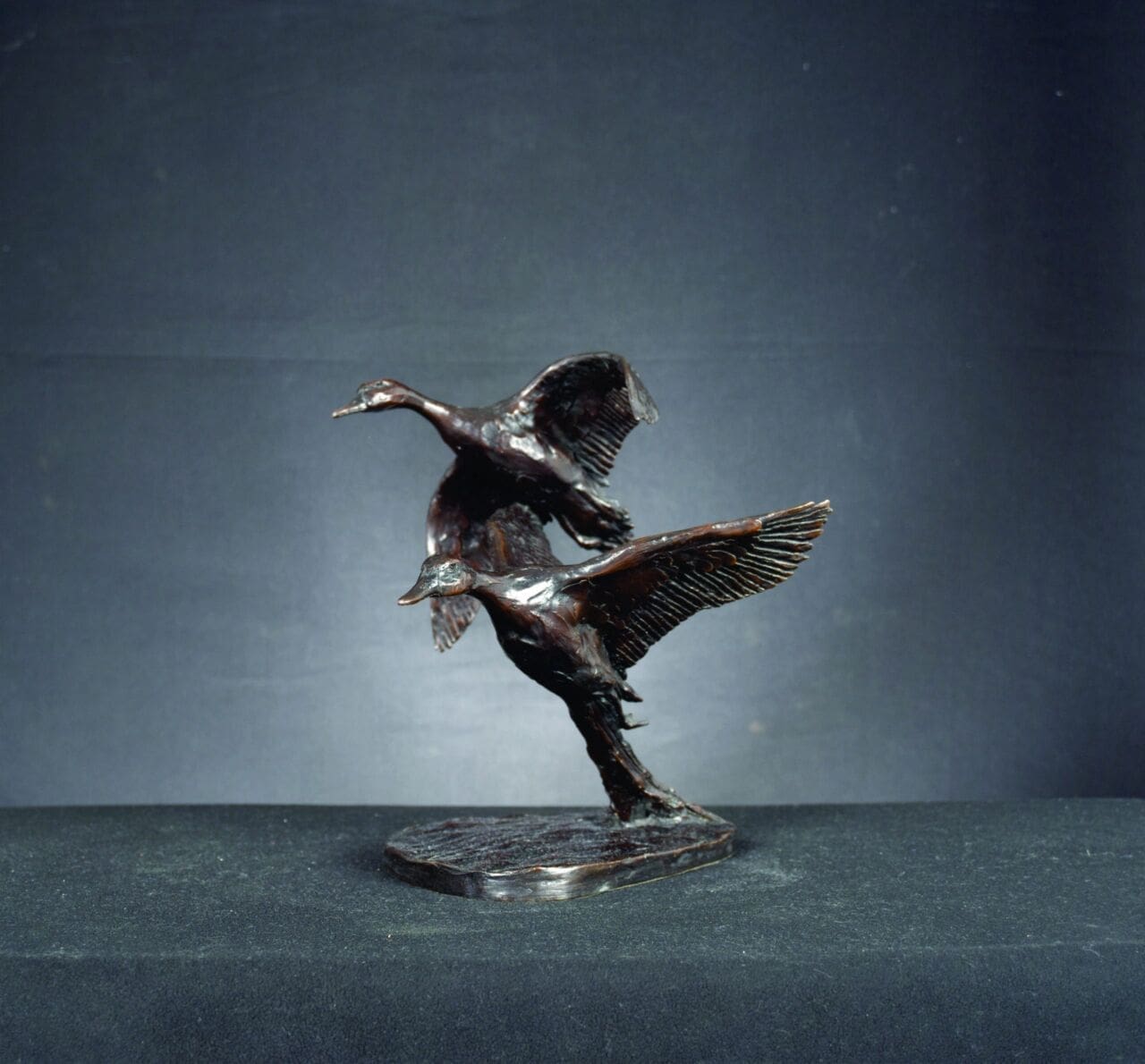 Bronze flying ducks sculpture by Bruce Little