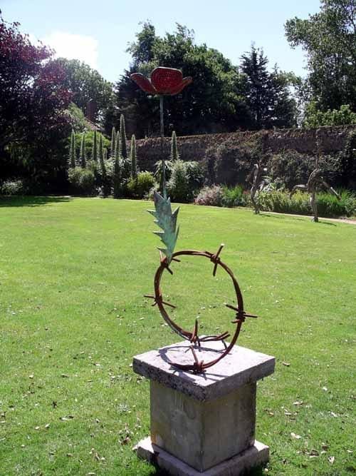 Bronze poppy sculpture “Hope” by Guy Portelli – remembrance and peace artwork.