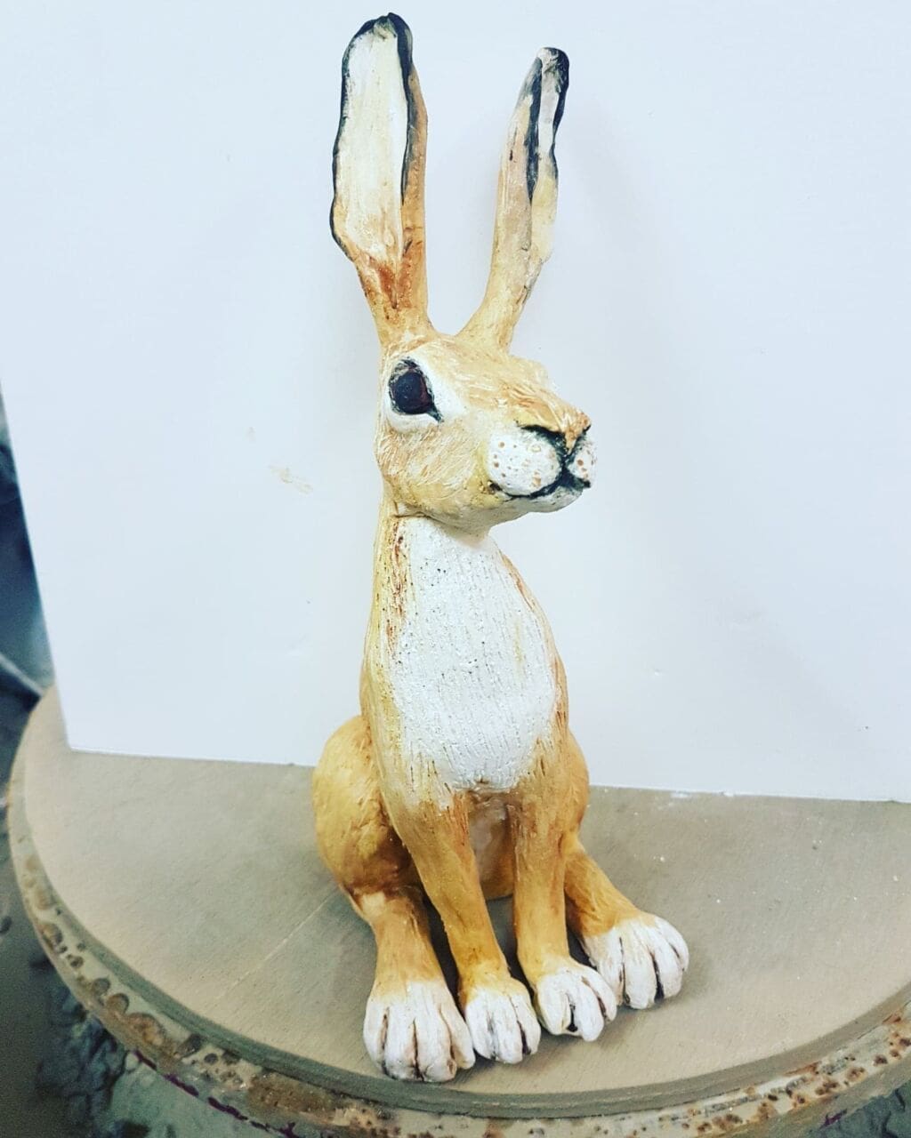 Ceramic happy hare sitting upright sculpture by Sara Grace Wevill