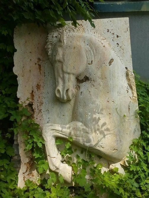 Large travertine stone horse relief wall sculpture by Andrej Mitevski