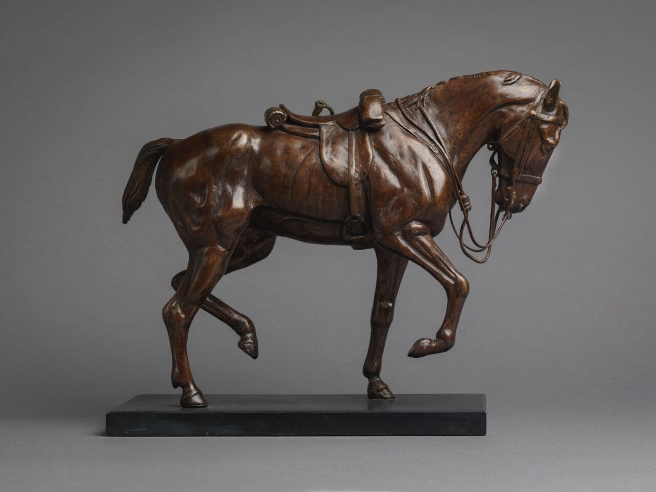 Bronze war horse sculpture by Jenna Gearing, small military-themed equine artwork.