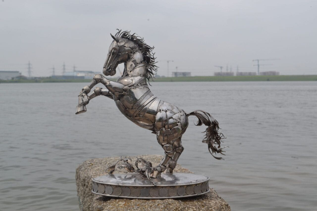 Rearing horse sculpture made from recycled stainless steel by Marcin Gornia