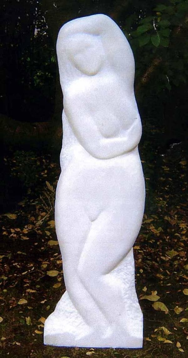 Stone sculpture “Woodland Nymph” by Michael Hipkins – curled nude figure inspired by nature.