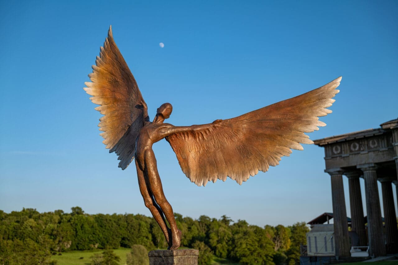 Bronze sculpture of Icarus flying with wings by Nicola Godden