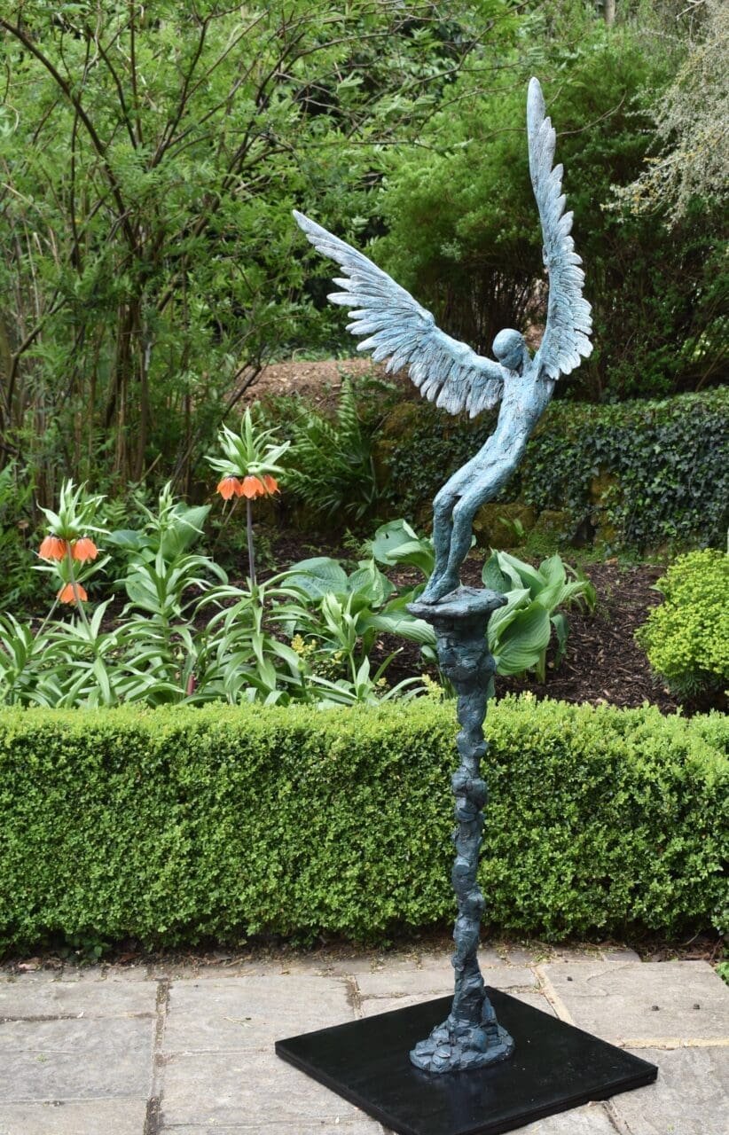 Bronze sculpture of Icarus falling from the sun by Nicola Godden with wings outstretched