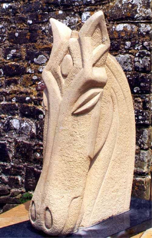 Stone sculpture “Horse Mask” by Perryn Butler – stylised primitive equine head carving.