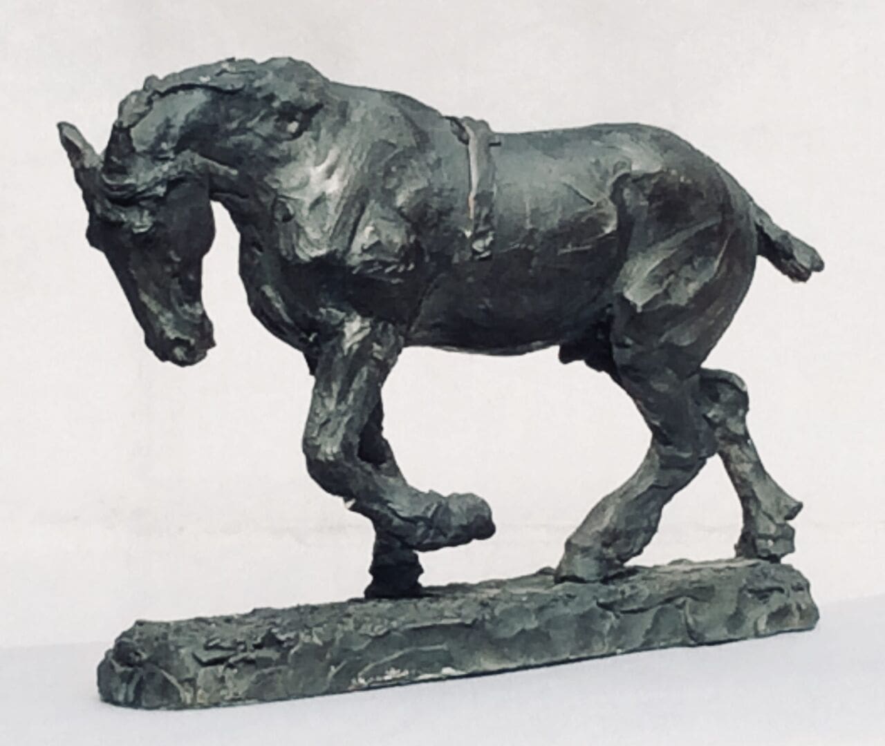Bronze sculpture of a weary plodding warhorse by Judy Boyt