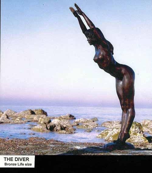Bronze sculpture of a nude female diver preparing to dive by Ronald Cameron.