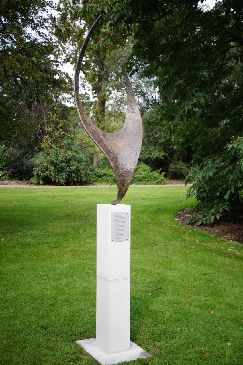 Bronze abstract garden sculpture “What I Do Is Me” by Tim Hollins.
