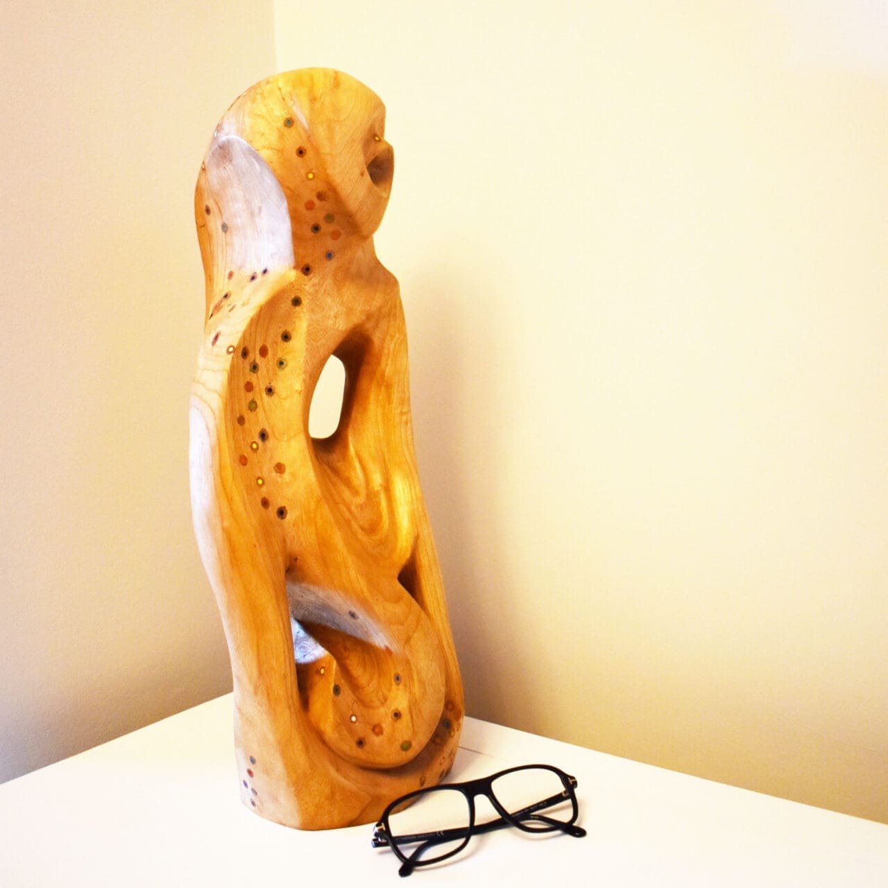 Carved cedar abstract sculpture Gathering by Cristina Rommel for interior spaces