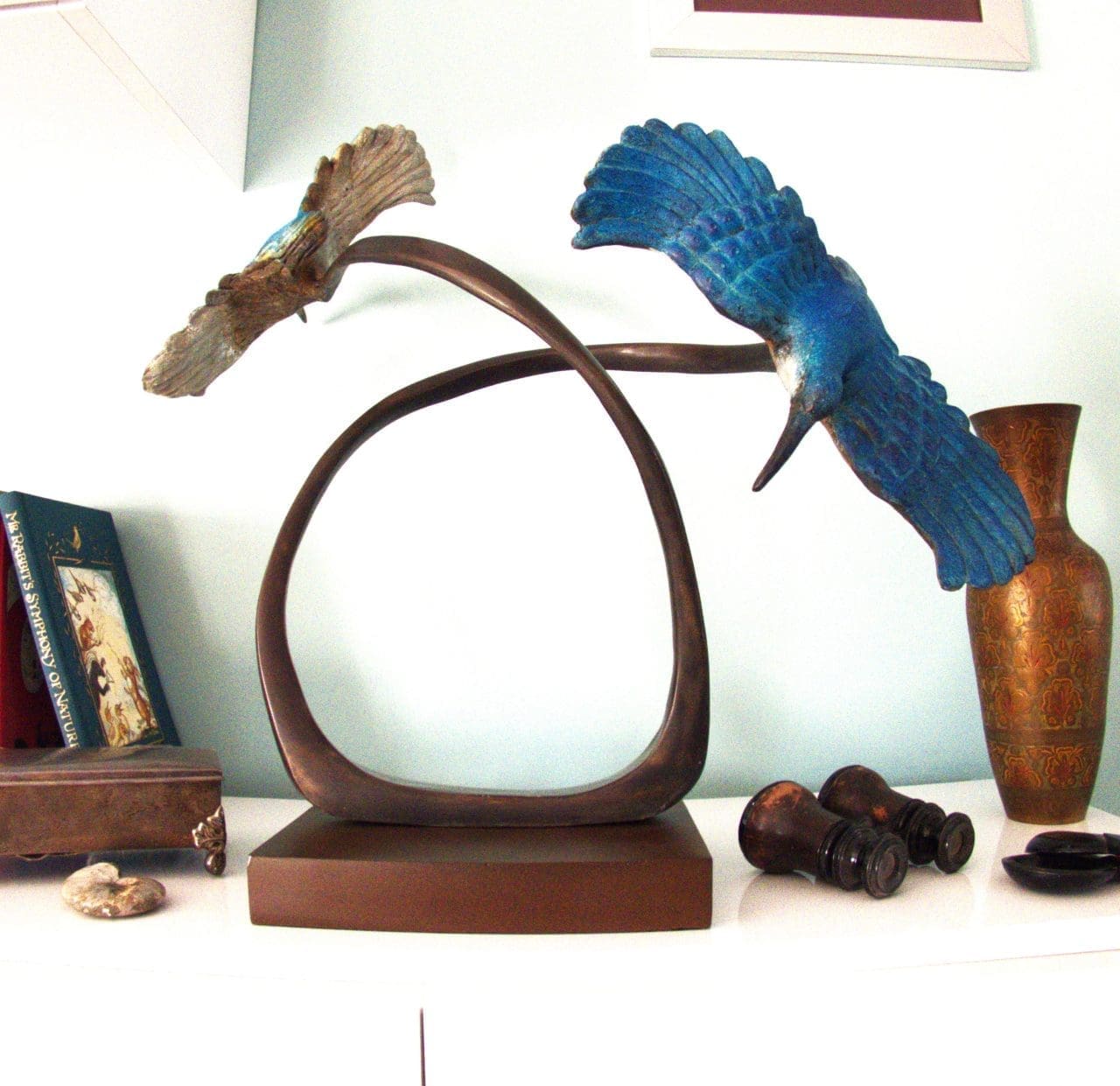 Bronze wildlife sculpture of kingfishers by Zita Abreu perched together