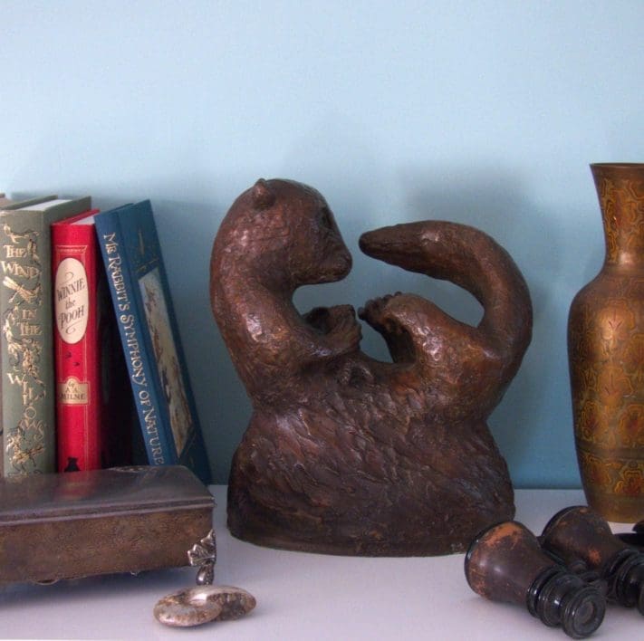 Bronze otter with fish sculpture by Zita Abreu for indoor display