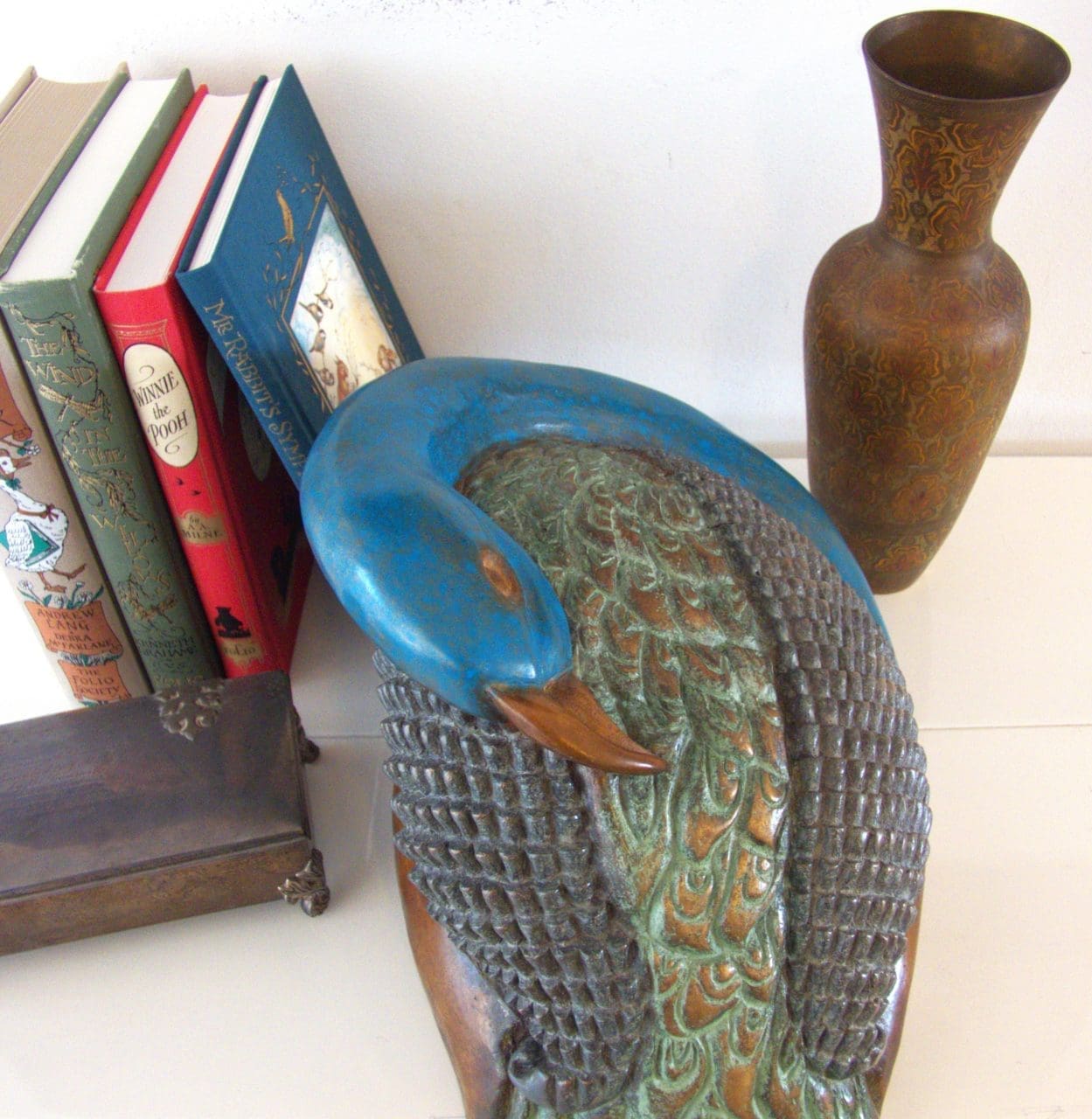 Bronze peacock sculpture by Zita Abreu with elegant upright form