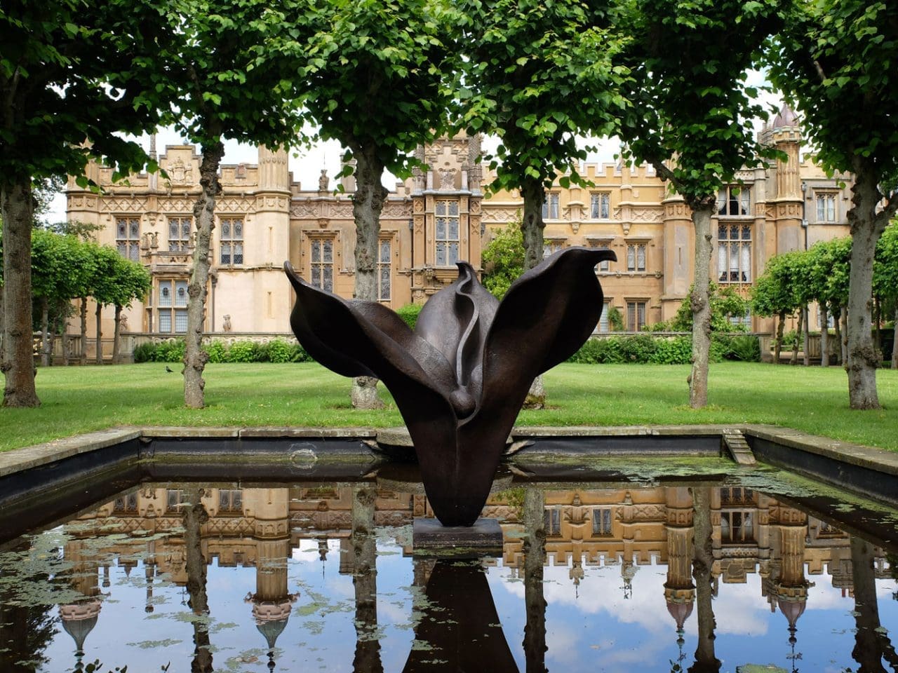 Large bronze figurative sculpture by Anne Curry exploring hope, promise and human connection.