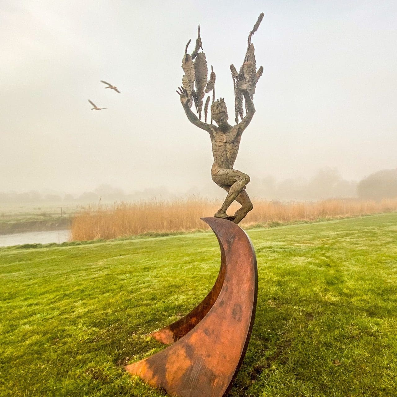 Tall bronze Icarus sculpture Icarus Fell Amid Feathers by Nicola Godden