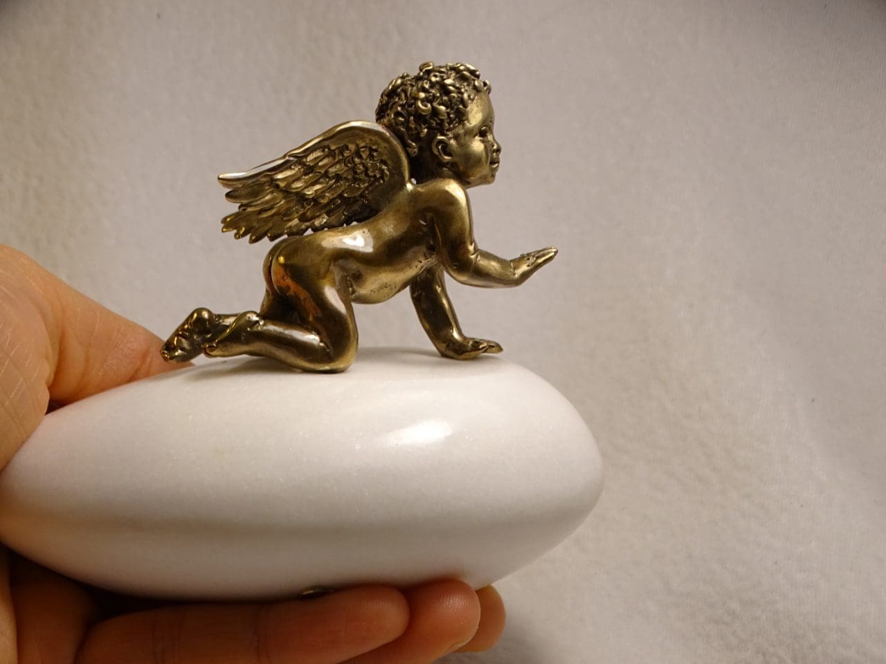 Small bronze smiling angel sculpture by Anna Tölgyesi Poós