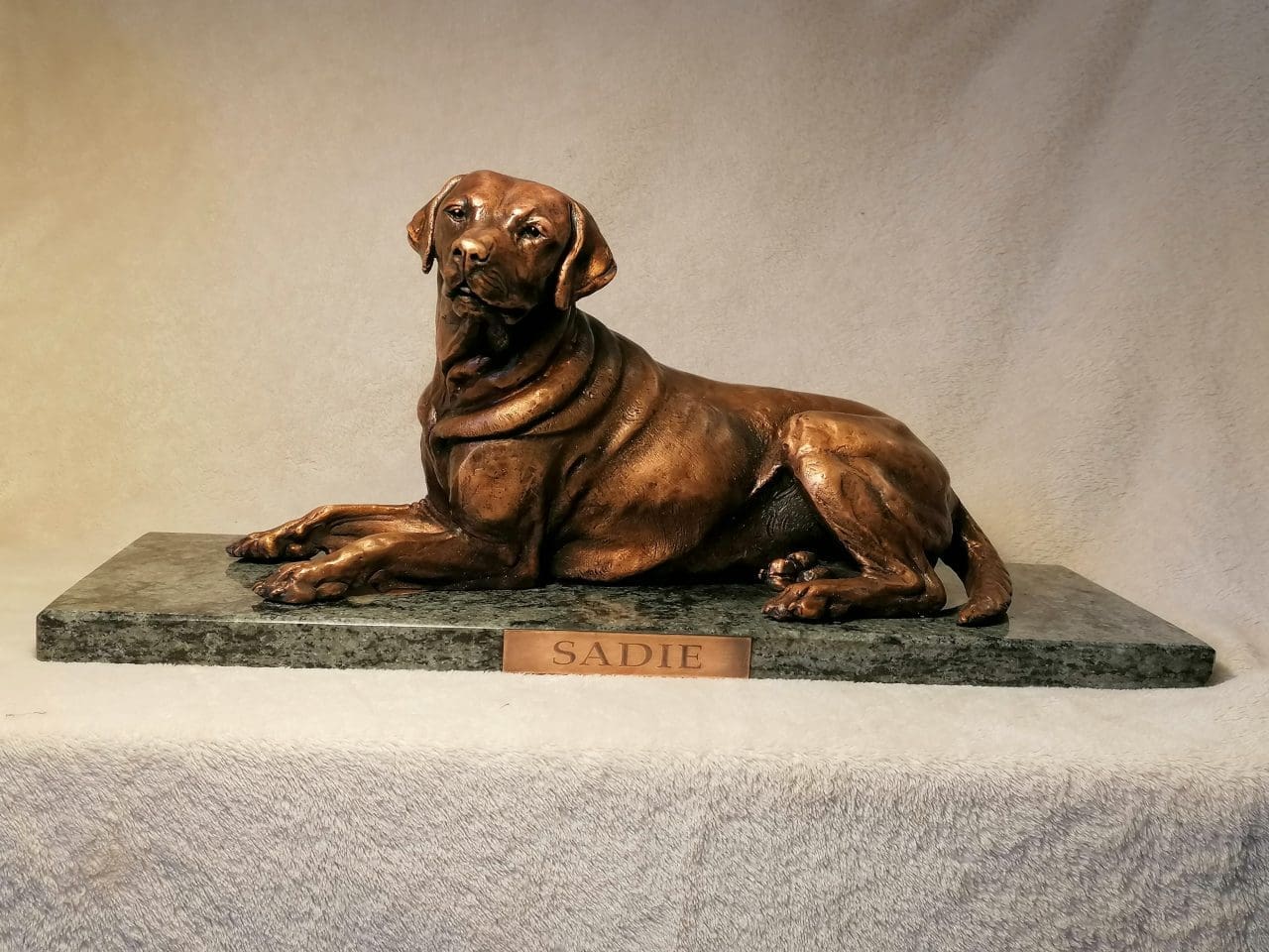 Bronze Lying Labrador dog sculpture by Anna Tölgyesi Poós