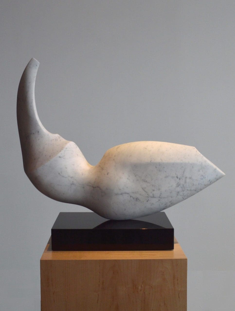 Carrara marble swan sculpture by Michael Binkley for interior display