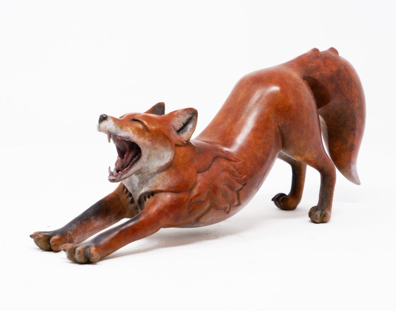 Stretching fox sculpture “Wake Up” by Ama Menec