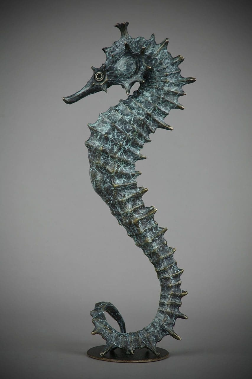 Bronze seahorse sculpture by Andrzej Szymczcyk with elegant stylised form.