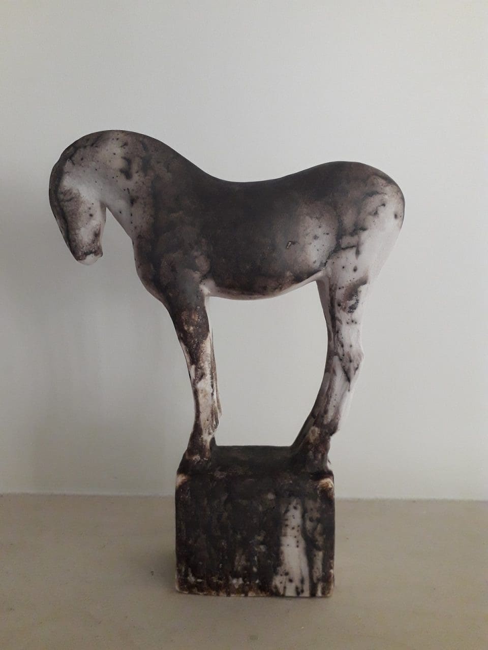 Raku-fired ceramic standing horse sculpture by Emma Walker.