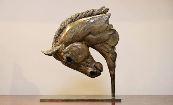 Bronze Etruscan-style horse head by Edward Waites with stylised ancient influence.