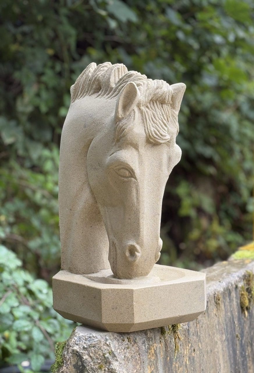 Carved natural sandstone horse head sculpture by Stephen Nicholson.