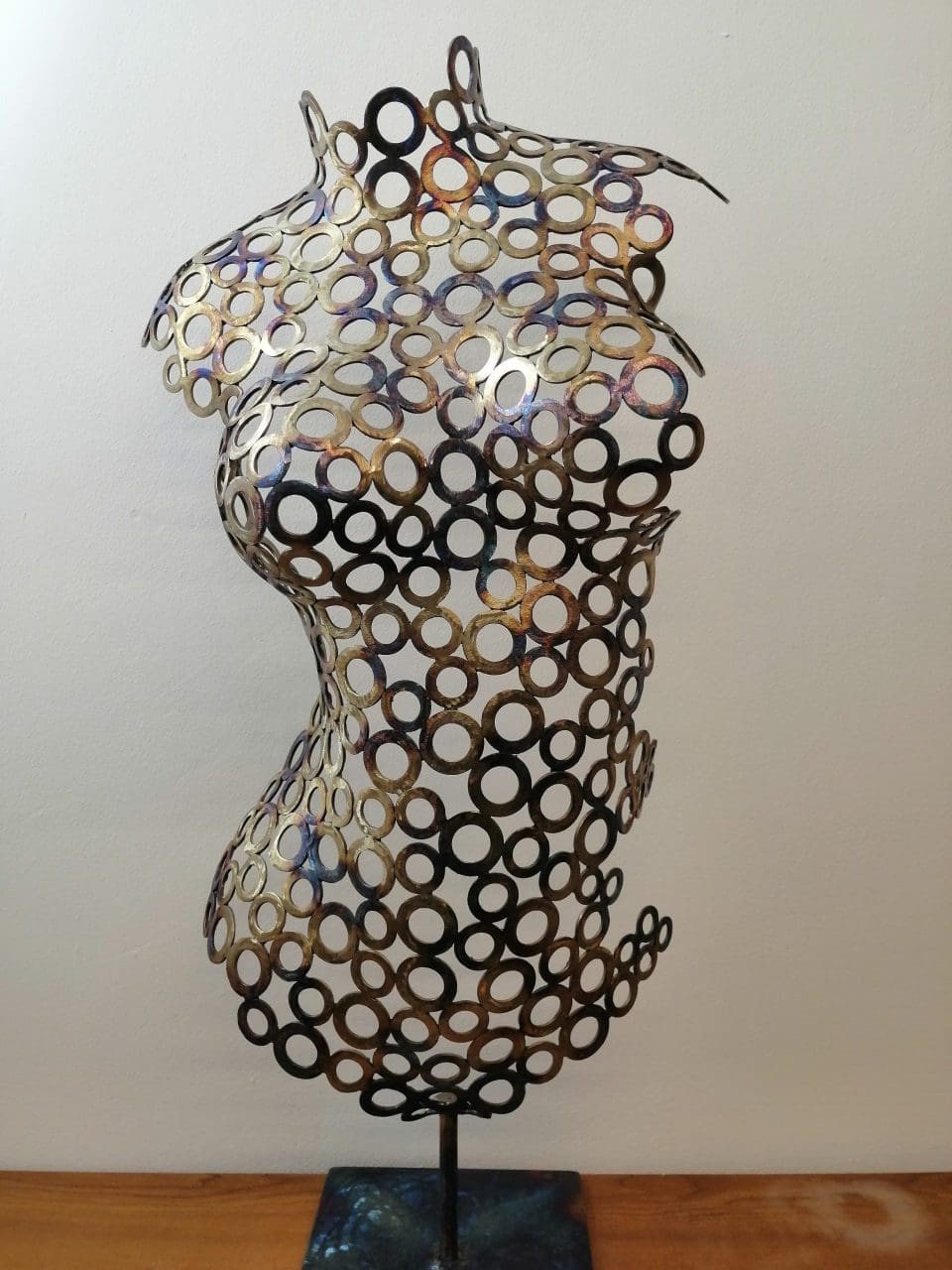 Tosia figurative sculpture made from metal washers by Anthony Jeffries