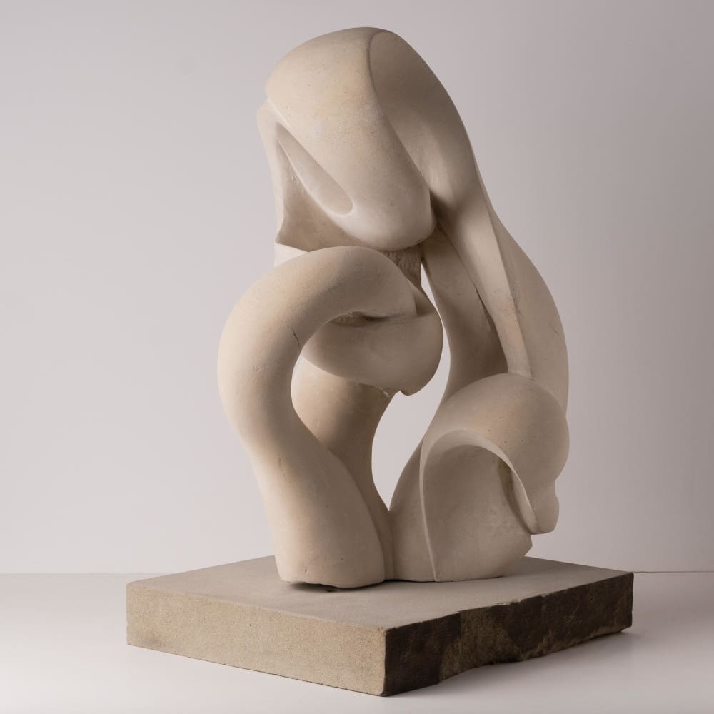 Cotswold stone sculpture of mother cradling her child by Carrie Horwood