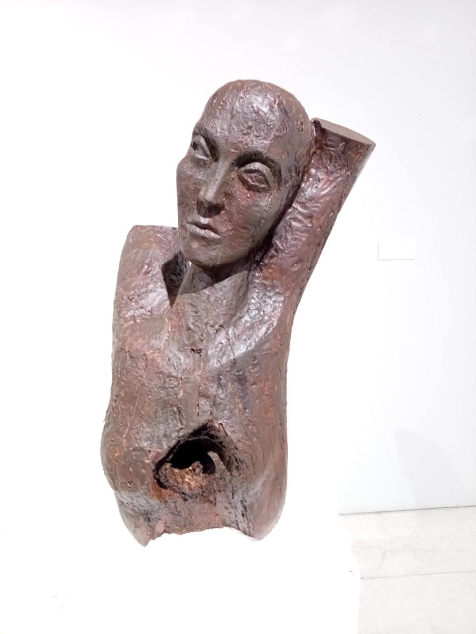 Expressive wooden female torso sculpture “Pain” by Tania Ivanova Tzanova