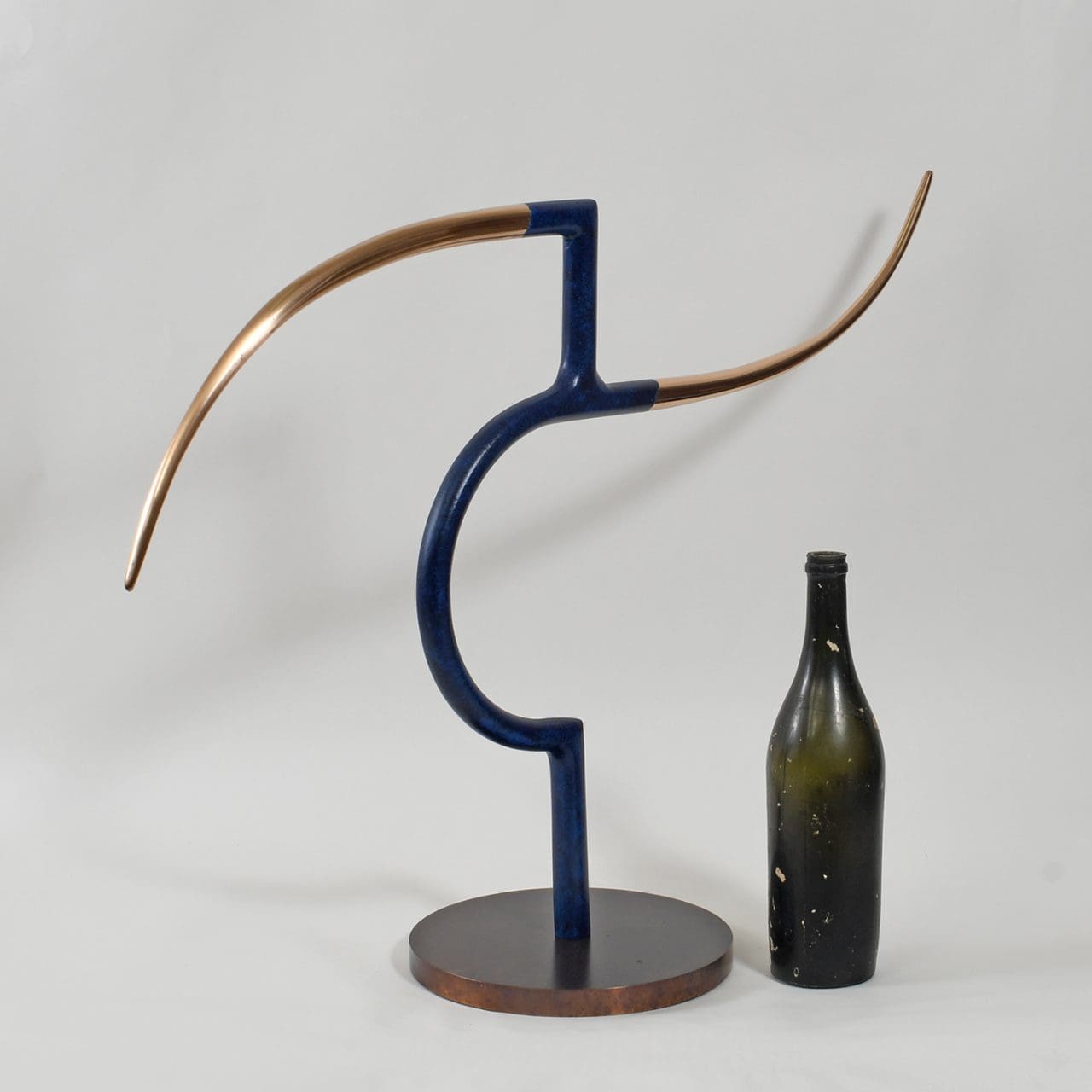 Large abstract bronze sculpture by Philip Hearsey exploring balance, connection and spatial relationships.