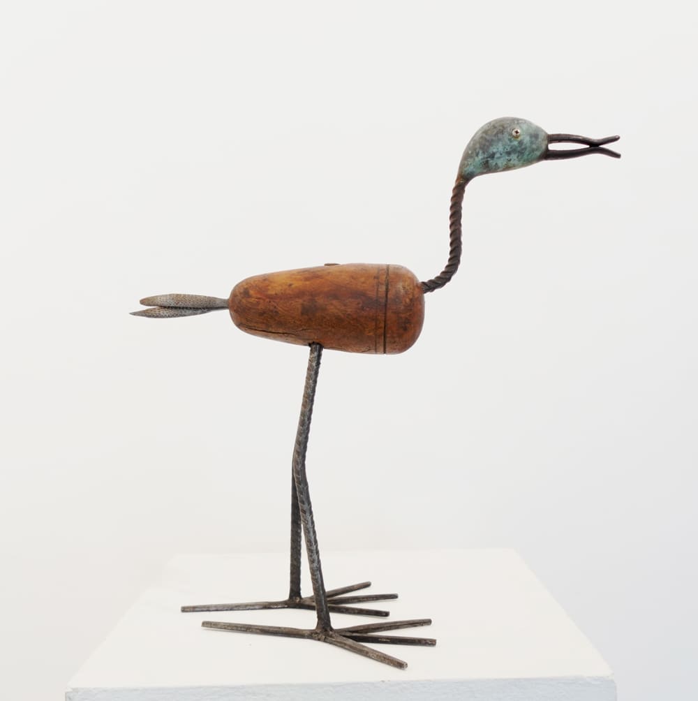 Handcrafted bird sculpture by Lawrie Simonson made from apple wood and metal.